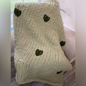 Beautiful handmade sage green knit blanket with 6 monstera leaves